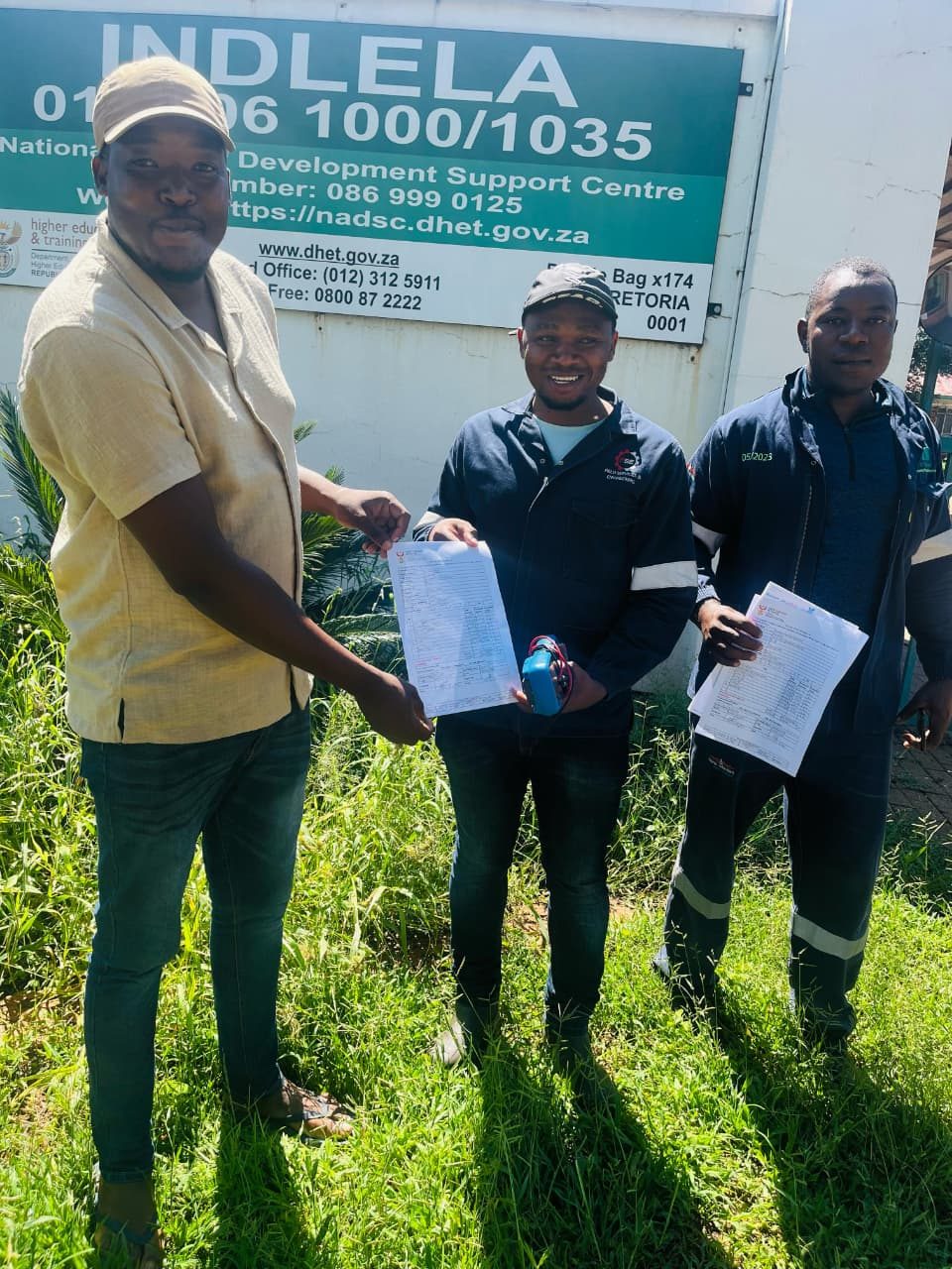 A candidate holding their trade certificate